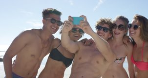 Group of beautiful friends taking selfies on the beach multi ethnic people on summer vacation RED DRAGON