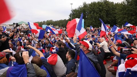ST. PETERSBURG, RUSSIA - JULY 10, 2018: French football fans singing at Saint-Petersburg stadium before the semifinal match of FIFA World Cup 2018 France vs Belgium. France won 1-0