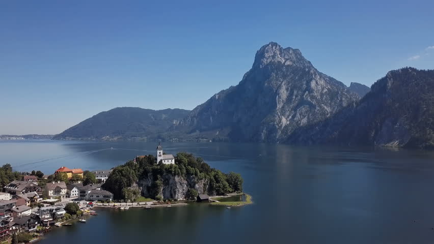 Flight over Traunkirchen church on Traunsee lake, in Salzkammergut, Upper Austria.