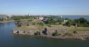 4K high quality summer morning aerial video of Helsinki Baltic Sea Finnish Bay lagoon area, city skyline, Suomenlinna Island with forts and cannons near the capital of Finland Suomi, northern Europe