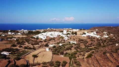 Aerial drone bird's eye view video of picturesque and traditional whitewashed village of Kato Petali, Sifnos island, Cyclades, Greece