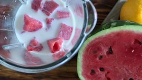 Cooking watermelon smoothie in blender close-up, slow motion video
