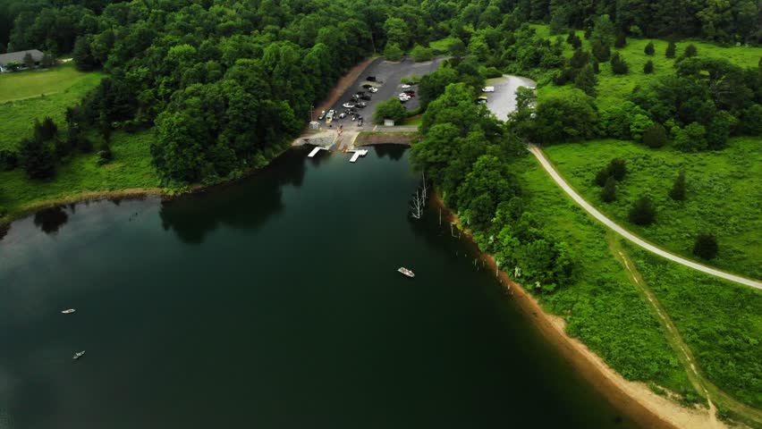 Aerial push in to Kayaks on Lake
