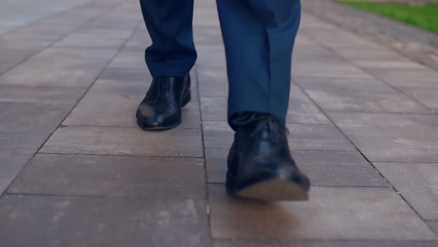 elegant man in blue shoes and pants going home after working day. shiny footwear walks on pavement. Royalty-Free Stock Footage #1013459897