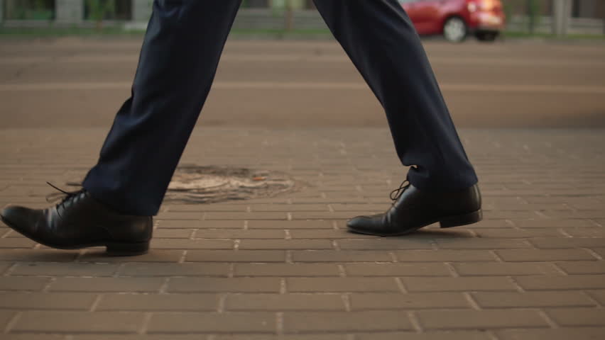 blonde haired man looking confident and independent. fairhaired wears black shoes and blue suit. Royalty-Free Stock Footage #1013459906