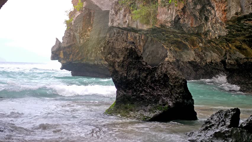 The splashes of water on the cave wall in ocean marble cave. slow motion. 3840x2160