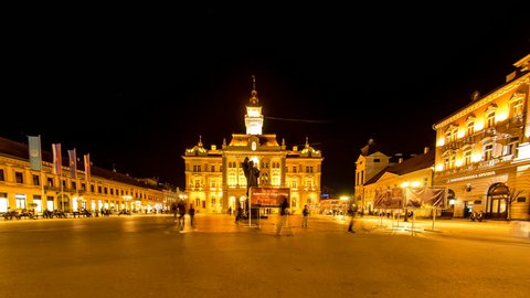 NOVI SAD, SERBIA - MAY 22: Time-lapse view on the center of the city at night as People pass by on May 22, 2017 in Novi Sad, Serbia.
