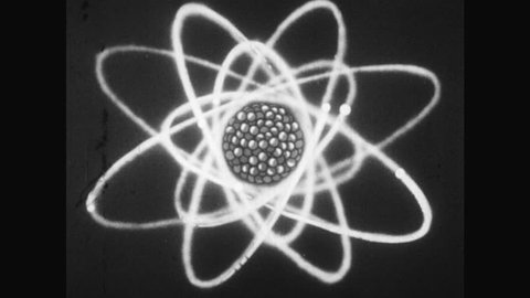 1950s: UNITED STATES: radioactive atom. Atom splits into two parts.