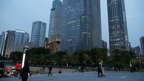 GUANGZHOU, CHINA - MARCH 13, 2018: Tilt up view to Chow Tai Fook Finance Centre building East Tower at evening twilight. Impressive mixed use skyscraper at Zhujiang new town, central business district