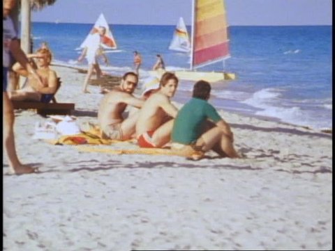 MIAMI, FLORIDA, 1982, Miami Beach, beach, sand, three men seated on beach