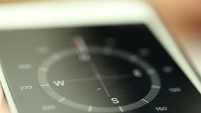 People using mobile compass online closeup blur background. Concept of Technology - Powered by Shutterstock - Get 15% off with code: PIKWIZARD15