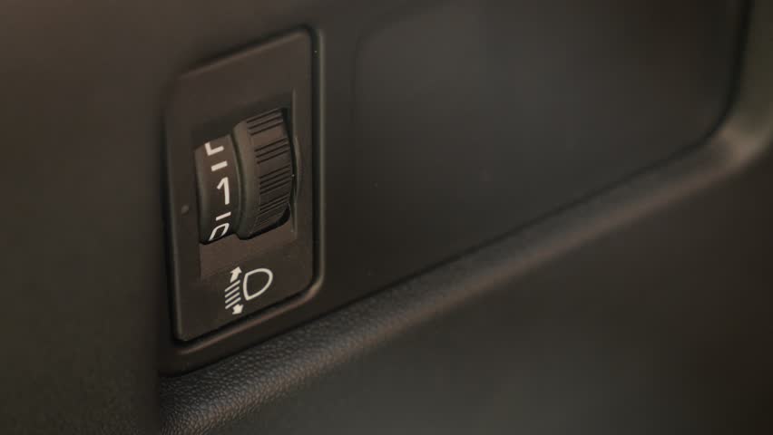 Level adjusting of car headlights 4K footage