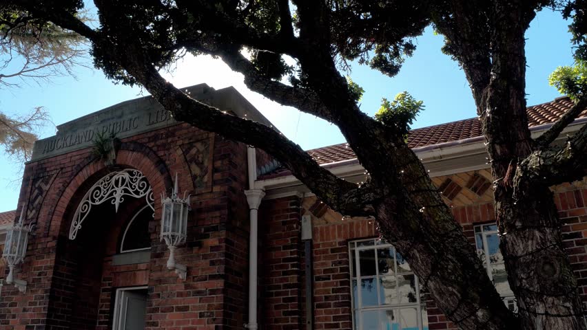 St Helliers Auckland New Zealand, historic old library building. Suburban shopping street. Sun flare