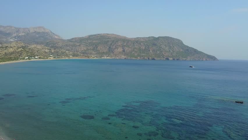 drone flight over the sea and beach of karpathos, greece.