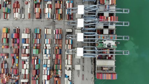 Aerial of cargo container ship in the cargo international yard port carrying full load ready to export .