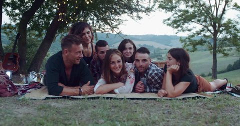 group of friends making faces during the pic nic. shot in slow motion