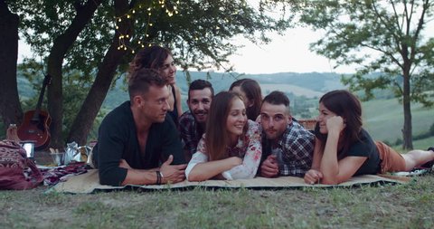 group of friends making faces during the pic nic. shot in slow motion