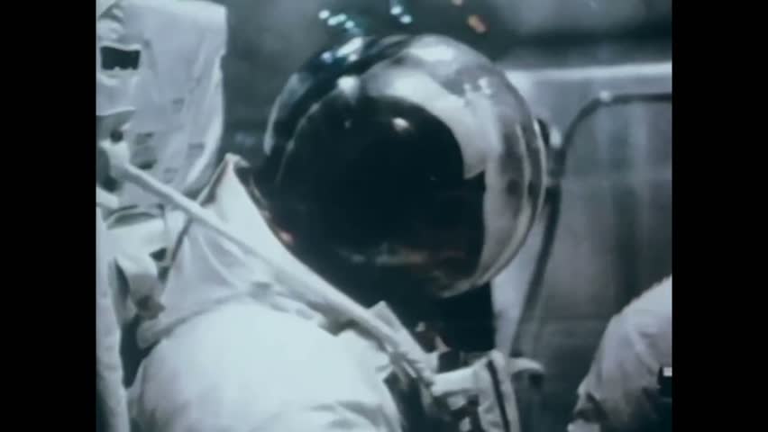 CIRCA 1971 - An astronaut ambles around on the moon. Royalty-Free Stock Footage #1013543807