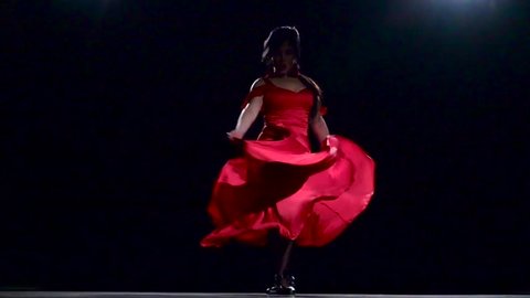 Woman performs elegant movements with her hands in sexual dance. Black background. Slow motion