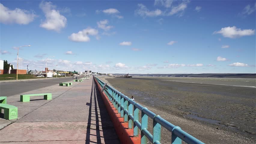 Men walking on the Waterfront in Rio Gallegos, Santa Cruz province, Argentina.