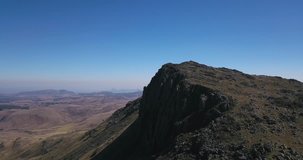 Aerial footage of Mt. Nyangani's peak in the Eastern highlands of Zimbabwe, the highest point in the country.