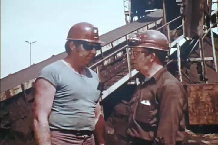 CIRCA 1980s - A miner replaces a broken guard in the 1980s