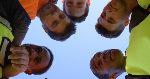 Close-up of soccer players forming a huddle 4k