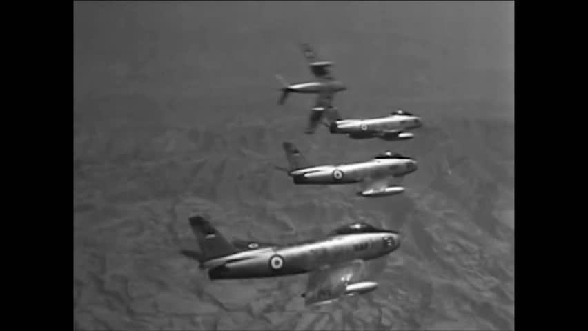 CIRCA 1964 - American F-100s back up Iranian F-86s in a strafing mission as part of Operation Delawor.