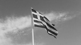 Black and white video shot of greek flag with blue background