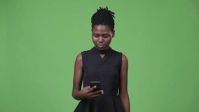 Young beautiful African businesswoman showing phone