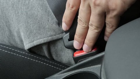 Passenger 3-point seat belt unlocking slow-mo footage