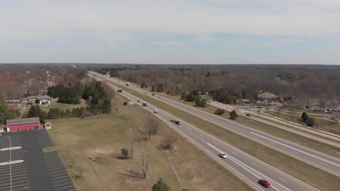 Aerial footage of major highway in early spring