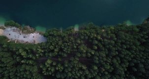Aerial drone video of beautiful Blue Lakes natural resort in Ukraine.Flying drone camera shoot footage of blue water and green forest from above.Travel destination in Europe.Over head view on beach