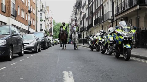 London, United Kingdom (UK) - 06 09 2018: Riot police on horses walk towards camera