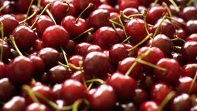 Background 4k video of ripe cherries rotating