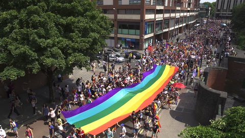 BRISTOL - July 14: Pride Parade Marching With LGBTQ Rainbow Flag Through City Centre , on July 14 2018 in Bristol England.