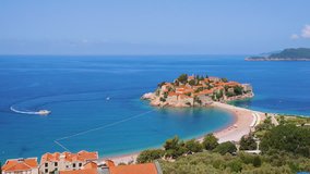 Aerial view of the small islet Sveti Stefan. Location place Montenegro Balkans, Adriatic sea, Europe. Scenic footage of european travel destination. Discover the beauty of earth. Shooting in 4K video.