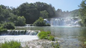 Skradinski buk the most unusual waterfall in Krka National Park. Location place Skradin resort (Lozovac), Croatia, Europe. Scenic footage of travel destination. Beauty of earth. Shooting in 4K video.