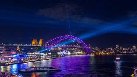 Sydney Harbour Bridge during Vivid Sydney Festival - timelapse video of the Spectacular light show and reflection around the Sydney Harbour Bridge