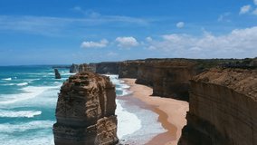 Stunning aerial drone view of the Twelve Apostles, a collection of limestone stacks & tourist attraction off the shore of Port Campbell National Park, by the Great Ocean Road in Victoria, Australia. 