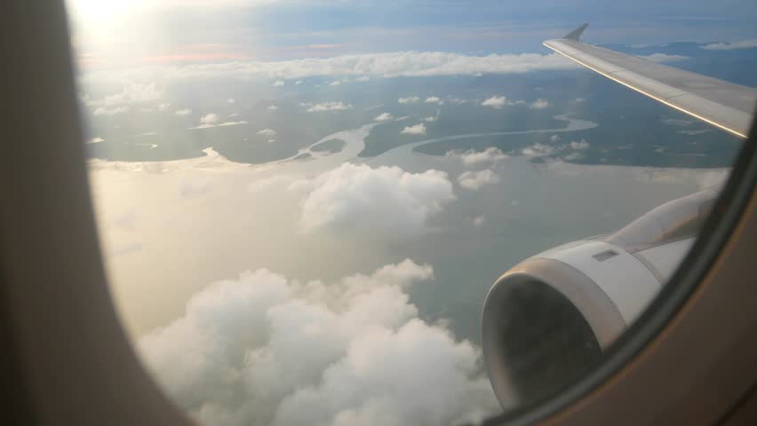 Aerial view of the sea coast in Thailand took from inside the plane's cabin on airplane near Phuket in Thailand while plane is going to land-4K UHD video movie footage short Royalty-Free Stock Footage #1013664497