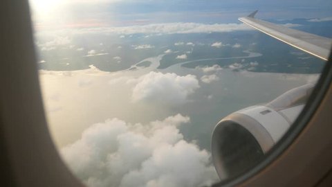 Aerial view of the sea coast in Thailand took from inside the plane's cabin on airplane near Phuket in Thailand while plane is going to land-4K UHD video movie footage short