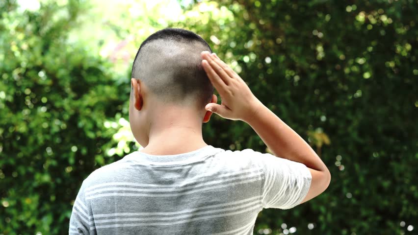 4k Young Asian boy feel comfortable with short hair cut.