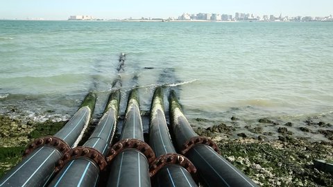 Pipes for intake of sea water and desalination in Doha, Qatar. Desalinization of sea water for city needs, water intake from Persian Gulf, Arabian Peninsula