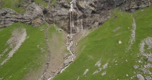 Aerial drone footage of waterfalls in the Swiss Alps.