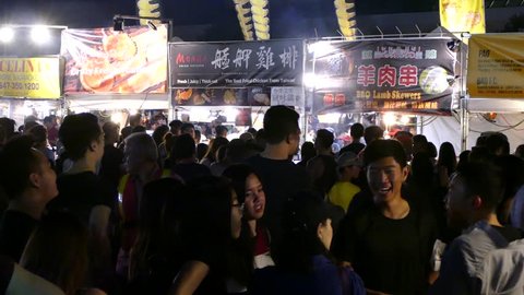 Markham, Ontario, Canada July 2018 Crowds of people on hot summer night at Asian market food festival in Markam