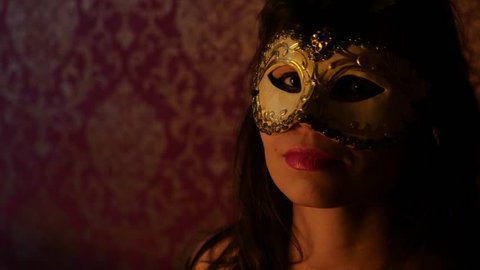 mysterious woman in a golden Venetian mask