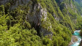 Attractive view of azure river Piva. Location place National park Durmitor, Montenegro, Balkans, Europe. Scenic footage of tranquil alpine valley. Discover the beauty of earth. Shooting in 4K video.