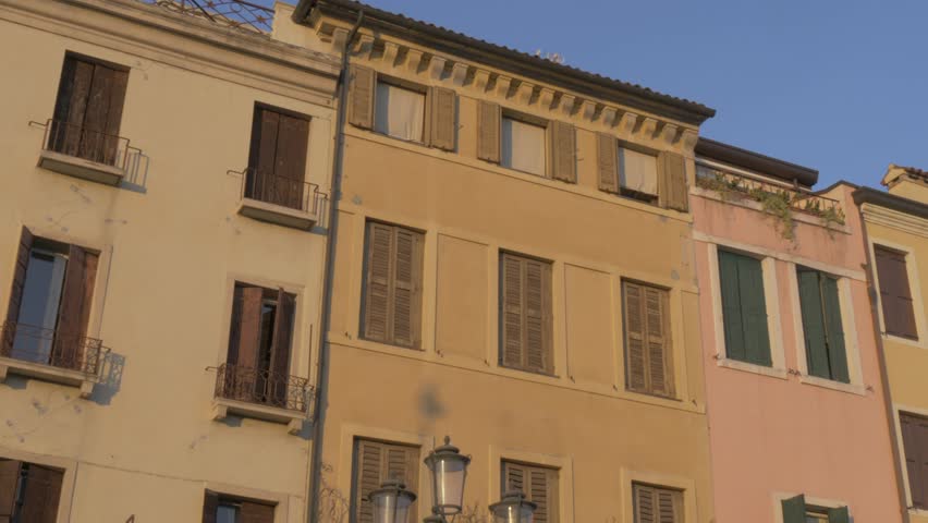 Panning shot of Prato della Valle architecture to Santa Giustina Basilica at sunset, Padua, Veneto, Italy, Europe