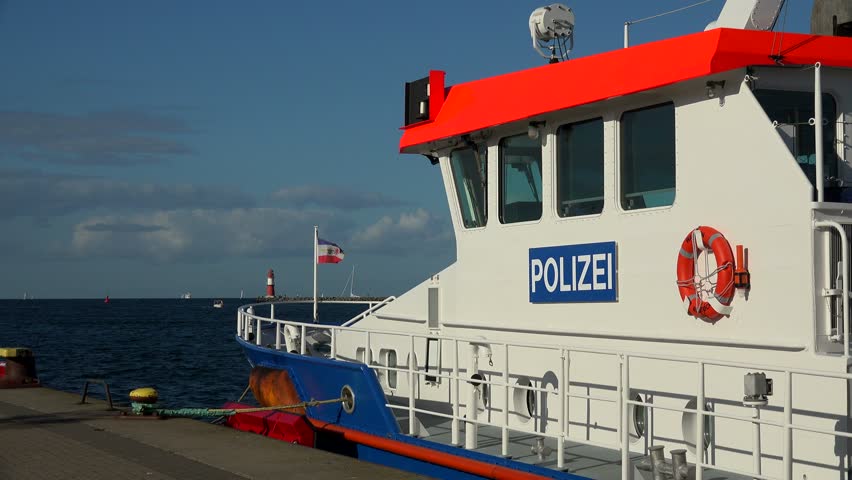 Police boat at the harbour entrance of Warnemuende, Rostock, Mecklenburg-Western Pomerania, Germany